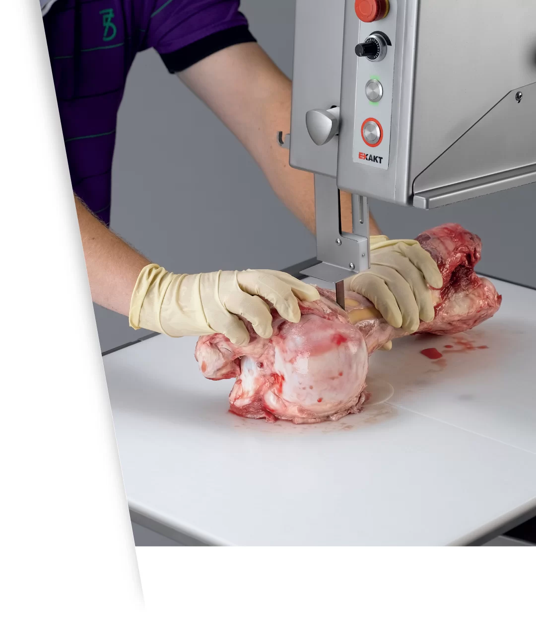 pathology technician using pathology saw to create samples