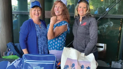 group of three ladies representing JetBlue volunteering at golf tournament