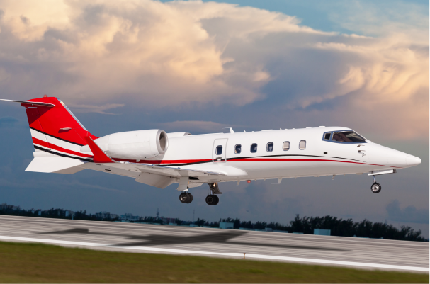 private jet aircraft with landing gear down coming in for landing