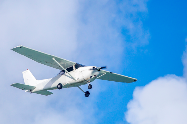 small private aircraft flying against beautiful clear blue skies
